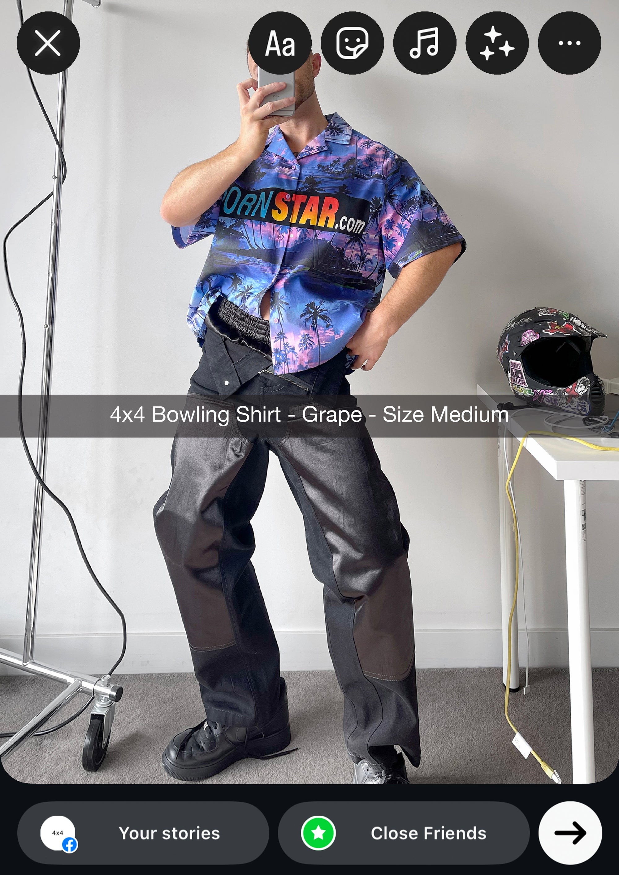 Person wearing a colorful '4x4 Bowling Shirt' with text, standing in a room.