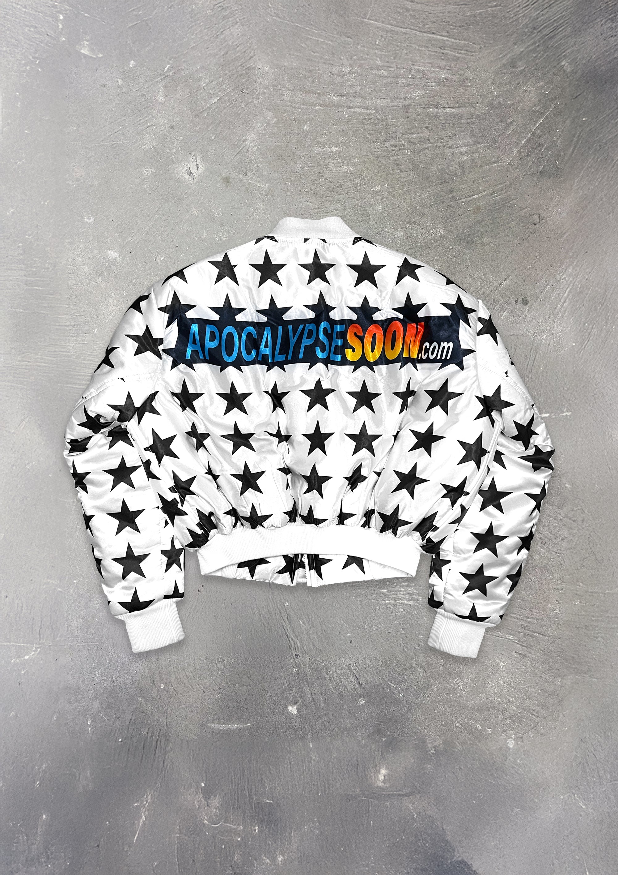 Sweatshirt with star pattern and 'Apocalypse Soon' text on a metallic surface