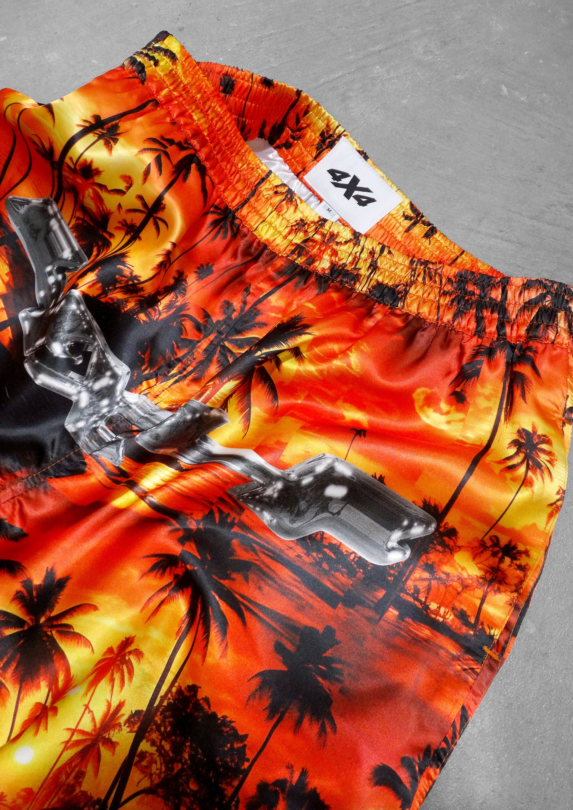 Hawaiian shirt with palm tree design on a gray background